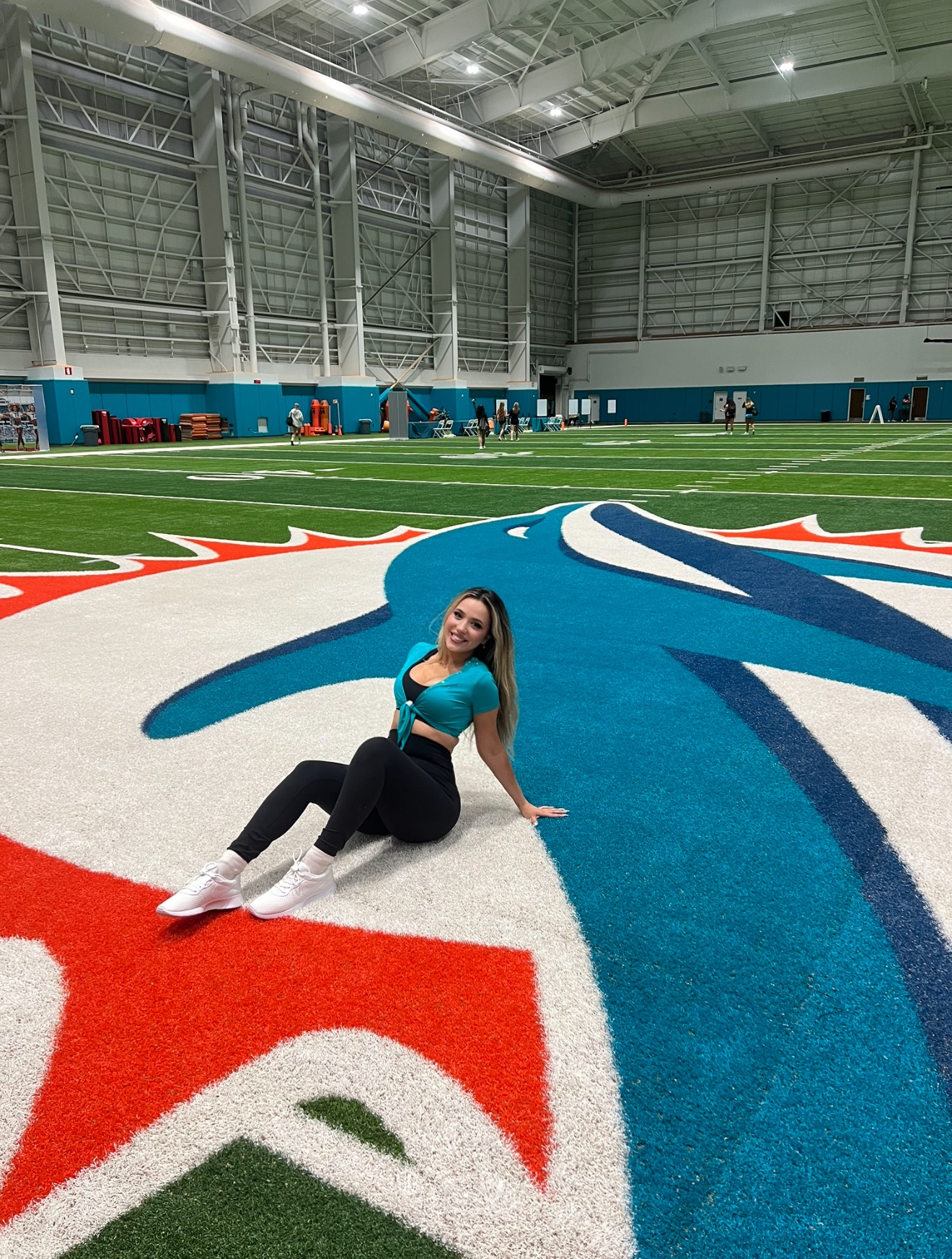 Bella on the Miami Dolphins practice field